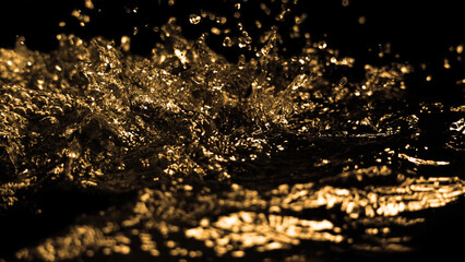 Hi speed close up images of oil liquid from diesel gasoline splashing and moving up to the air on black background. Power of fuel liquid that active and powerful. studio shot premium gold color tone.
