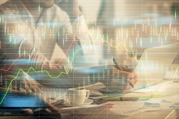 Multi exposure of man and woman working together and financial chart hologram. Business concept. Computer background.