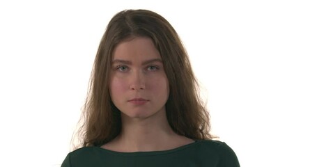 Close-up portrait of young Caucasian woman with a sealed mouth tearing yellow tape from her lips. Don't be silent. Women against abuse and harassment concept. Isolated on white background - Powered by Adobe