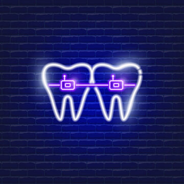 Teeth with self-ligating braces neon icon. Orthodontics concept. Sign for dentistry clinic.