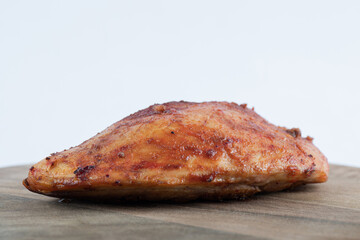 A wooden board with tasty fried chicken