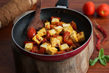 Matar Paneer curry, paneer butter masala recipe made using cottage cheese, green peas, served in a bowl.  Delhi, Rajasthan India. Indian veg curry wooden background. side dish of Roti, Chapati, naan