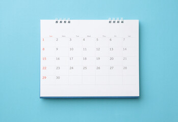 desk calendar on blue background business planning appointment meeting concept - obrazy, fototapety, plakaty