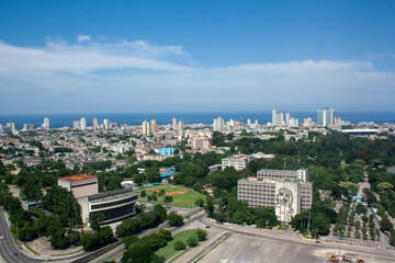 Aerial view of Havana from the José Martí Memorial next to the Revolution Square with the steel monument of Che, the buildings of the city and the sea in the background