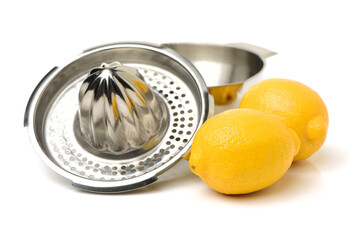 yellow lemon and lemon-squeezer on white background