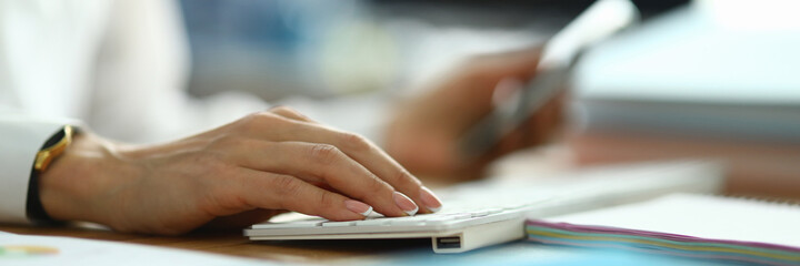 Nurse type text. Woman in white coat hold her hand on white keyboard. Doctor press button with her...