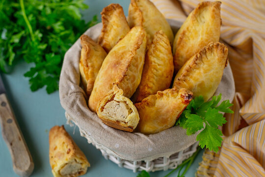 Traditional Lithuanian savoury pastries Kibinai filled with ground chicken and onions