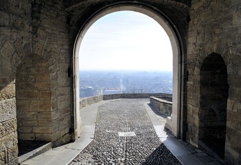 Bergamo old Italian town medieval arch stone buildings urban panorama horizon beautiful cityscape background