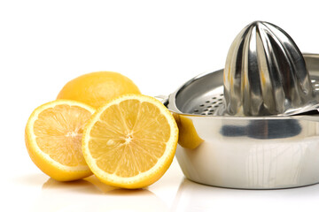 yellow lemon and lemon-squeezer on white background