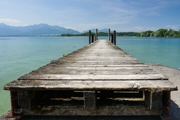 Weathered landing stage shot from low angle with lines converging on the horizon