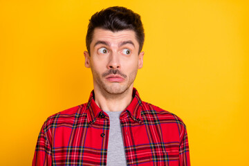 Photo of young handsome unhappy upset nervous stressed man look copyspace have problem isolated on yellow color background