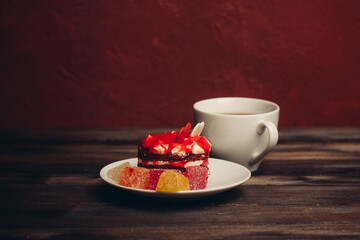 cake on a saucer cup of tea dessert snack enjoyment