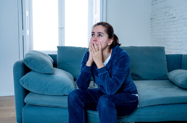 Young sad woman suffering from depression feeling lonely and hopeless isolated at home