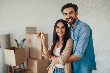 Smiley woman and her husband being glad about new house
