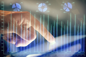 Multi exposure of man's hands holding and using a phone and financial chart drawing. Market analysis concept.