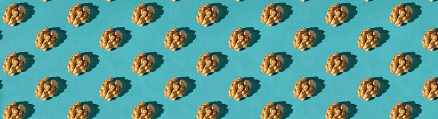 walnuts on a turquoise background. kernel of a nut on a blue texture.