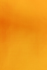 Gold or yellow paint on cement wall texture or background