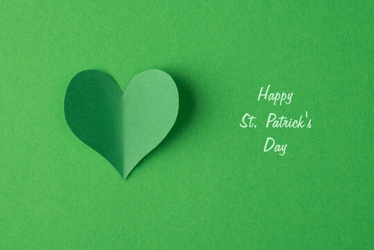 Happy St. Patrick's day concept. Flatlay close up view photo image of vibrant color heart isolated bright backdrop with text