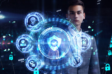 Cyber security data protection business technology privacy concept. Young businessman  select the icon security on the virtual display.