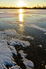 the first ice on the sun at sunset