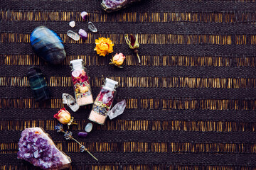 Handmade spell jar bottles with good intentions for home protection and inner balance. Filled with Himalayan rock salt, dried herbs and semi precious stone chips. Magical item. Lot of copy space.