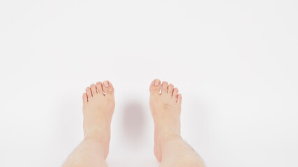Obraz premium Asian Male barefoot and legs is isolated on white background.