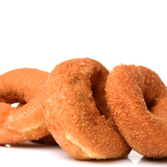 a pile of rosquillas, typical spanish donuts on white background