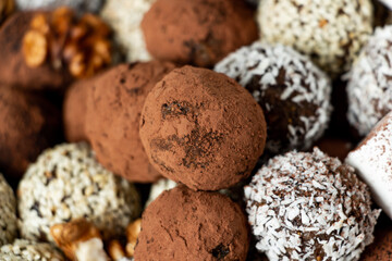 truffles with cocoa, coconut and sesame seeds with chocolate and marshmallows, delicious dessert