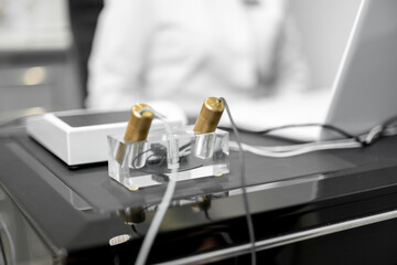 Bioenergetic testing device with brass handpieces and results of diagnostic on computer screen in...