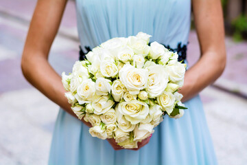 Beautiful White Bouquet of Roses in Woman Hands 