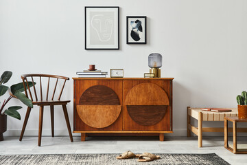 Stylish retro scandinavian living room interior with wooden commode, mock up poster frames, chiar,...