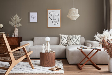 Modern concept of living room interior with design modular sofa, rattan armchair, dried flowers in...