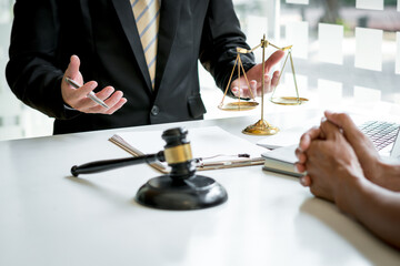 Consulting and finding a solution Concept, businesspeople consult with a lawyer or judge to find...