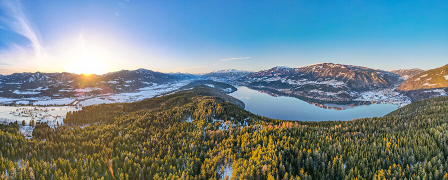 winter panorama with lake and sunset