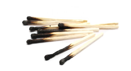 Burnt fire matches pile, burned matchsticks group isolated on white background