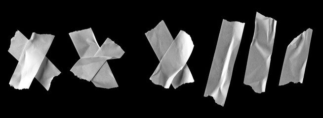 White paper tape pieces set and collection isolated on black background with clipping path, top view