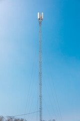 New telecommunication antenna on background of blue sky. Satellite dish telecom network at communication technology network. Telecom broadcasting tower. Modern cell tower 5G, 6G