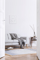 Stylish scandinavian interior of living room with design grey sofa, retro wooden table, mock up...