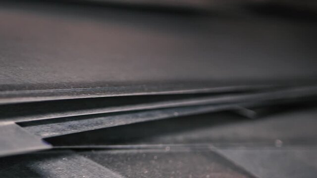 Thin galvanized sheet metal stacked in a pile for metalworking