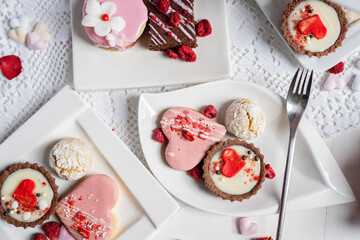 beautiful tasty romantic selection of pink chocolate love heart shape cakes for wedding, mothers...