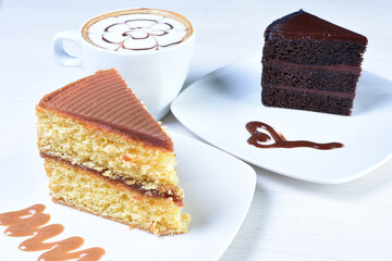 Cup of Colombian coffee, accompanied by baked cake on white wooden background