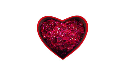 Close up of lots of hearts in red gift box in form of heart. Small red hearts in box for present on isolated white background. Concept of goodness, love and charity.