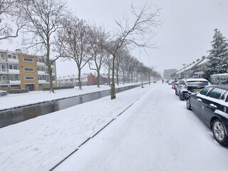 Snow on the streets and frozen water during the winter of 2021 in Nieuwerkerk