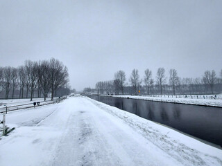 Snow on the streets and frozen water during the winter of 2021 in Nieuwerkerk