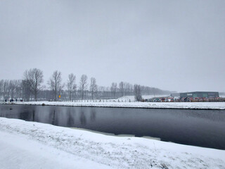 Snow on the streets and frozen water during the winter of 2021 in Nieuwerkerk