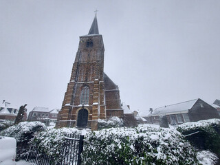 Old reformed church in Nieuwerkerk aan den IJssel in the Snow