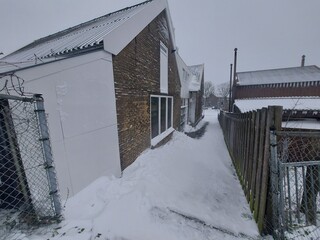 Snow on the streets and frozen water during the winter of 2021 in Nieuwerkerk