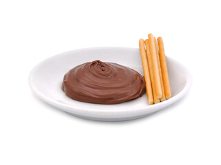 Bowl of chocolate cream and breadsticks isolated on white