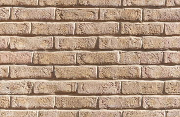 Seamless background texture of yellow brick wall