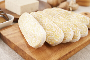 Beautiful close up of sliced homemade traditional Indonesian food made from fermented soybeans which is one of the healthiest alternative plant protein for Vegan and Plant-based diet. Probiotics food.